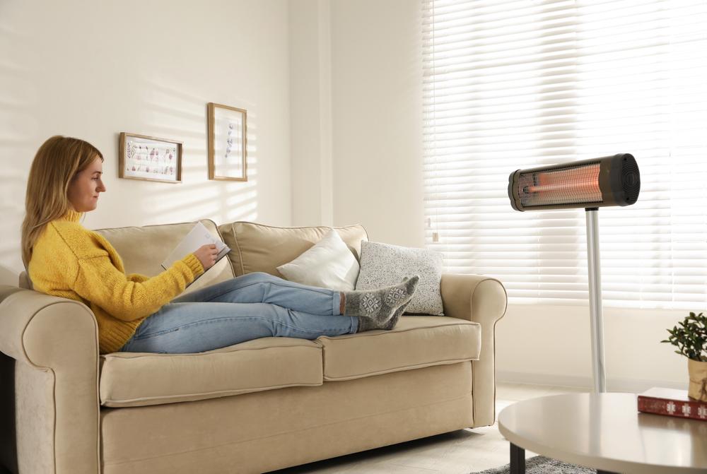 A great way to keep heating costs down is to use a space heater in occupied rooms. (New Africa/Shutterstock)