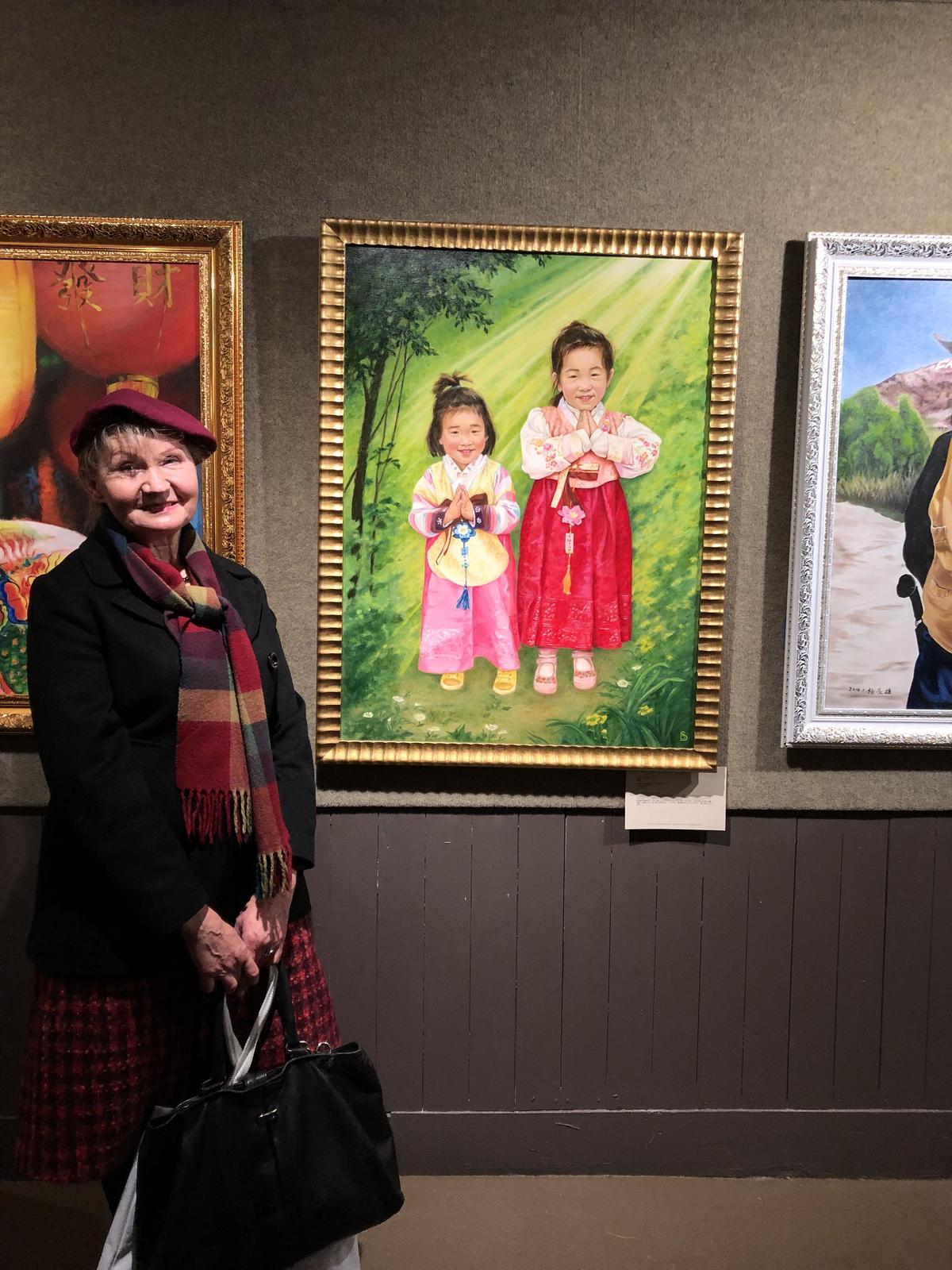 Barbara Schafer with her oil painting "Gratitude" on exhibition at the 2019 NTD International Figure Painting Competition in New York. (Courtesy of Barbara Schafer)
