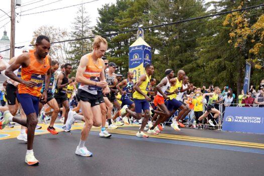 The elite men break from the starting line of the 125th Boston Marathon, in Hopkinton, Mass., on Oct. 11, 2021. (Mary Schwalm/AP Photo)