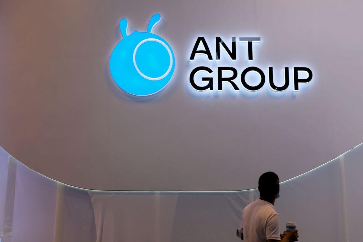 A man walks past an Ant Group logo at the World Artificial Intelligence Conference (WAIC) in Shanghai, China, on July 8, 2021. (Yilei Sun/Reuters)