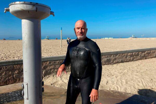Richard Beach, 69, of Huntington Beach, Calif., said he was told to leave the ocean by lifeguards after he returned to the waves to body-board in Huntington Beach, Calif., on Oct. 10, 2021. (Amy Taxin/AP Photo)