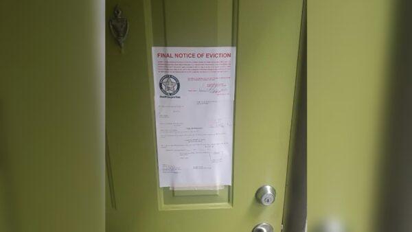 Eviction notice on Carlos Lomena's door at the Axis at One Pine apartments in Plantation, Fla., on June 28, 2021. (Charles Trainor Jr./Miami Herald/TNS)