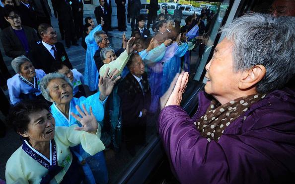 South Koreans in a bus bid farewell to their North Korean relatives before they return to their home after a family reunion, having been separated for 60 years following the Korean War, in Mount Kumgang, North Korea, on Nov. 5, 2010. (Kim Chang-gil/Korea Pool/Getty Images)