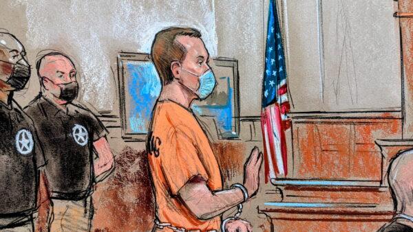 In this courtroom sketch, former U.S. Navy engineer Jonathan Toebbe appears for his first court hearing on charges that he and his wife Diana attempted to sell secrets about nuclear submarines to a foreign power in exchange for cryptocurrency, is seen in Martinsburg, West Virginia, on Oct. 12, 2021. (Bill Hennessey/Reuters)