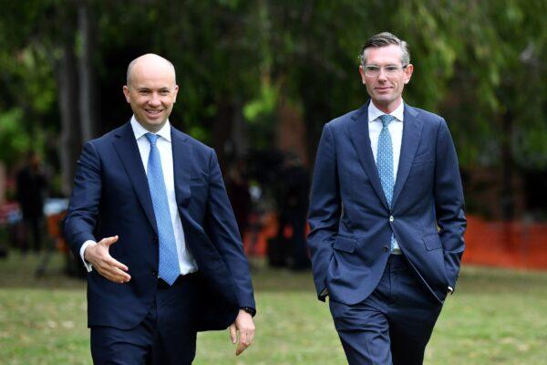 Former NSW Premier Dominic Perrottet (R) and MP Matt Kean leave a press conference in Sydney, Australia, on Oct. 12, 2021. (AAP Image/Joel Carrett)