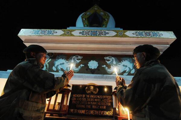 Indian Army personnel light candles in memory of those soldiers who sacrificed their lives in the 1962 Indo-China war at the Tawang War Memorial in Arunachal Pradesh, Indian, on Oct. 20, 2012. (Biju Boro/AFP via Getty Images)