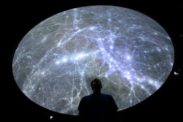 Hadrien Gurnel, software engineer EPFL’s Laboratory for Experimental Museology (eM+) explores the most detailed 3D map of the universe in St-Sulpice near Lausanne, Switzerland, on Oct. 12, 2021. (Keystone/Laurent Gillieron)