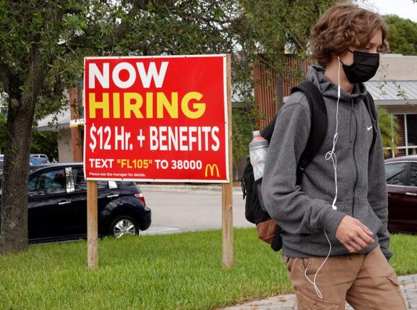 A 'now hiring' sign outside of a business in Miami, on Oct. 8, 2021. (Joe Raedle/Getty Images)