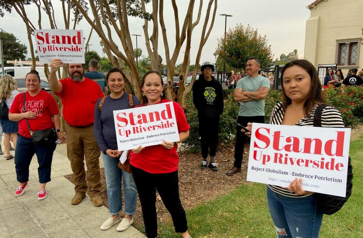 Parents and teachers hold signs in protest at Riverside Unified School District in Riverside, Calif., on Oct. 7, 2021. (Courtesy of Heather Knapp)