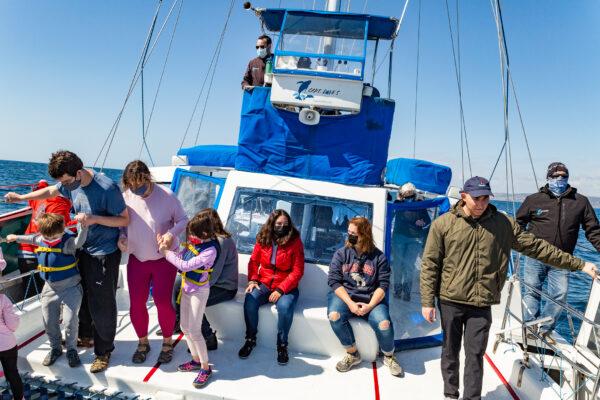 People enjoy Captain Daves Dolphin and Whale Watching Safari in Dana Point, Calif., on March 8, 2021. (John Fredricks/The Epoch Times)