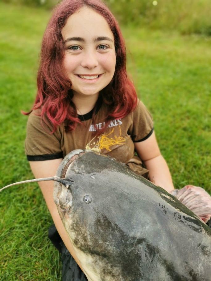 Hannah Truscott, 15, with her catch at White Lakes in Essex. (SWNS)