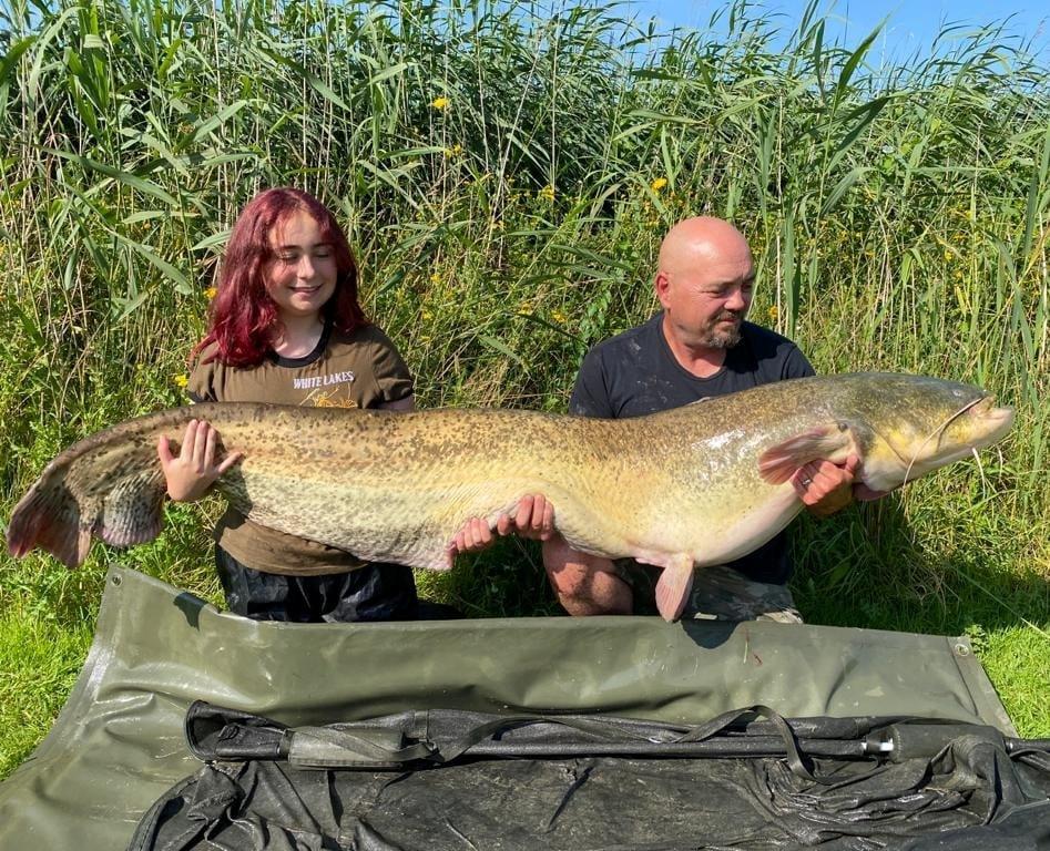 Hannah and her dad, Paul, with her massive catch. (SWNS)