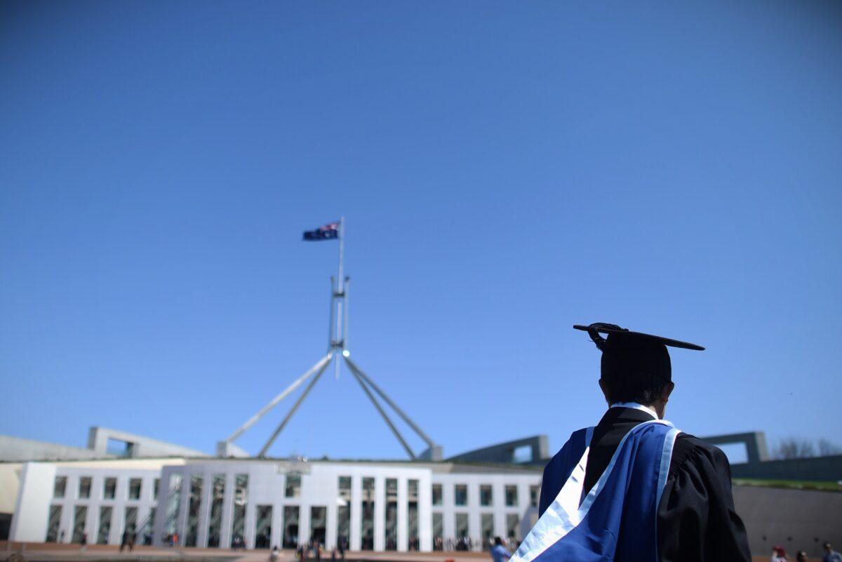  A university graduate is seen outside Parliament House in Canberra, Australia, on Oct. 1, 2015. (AAP Image/Lukas Coch)