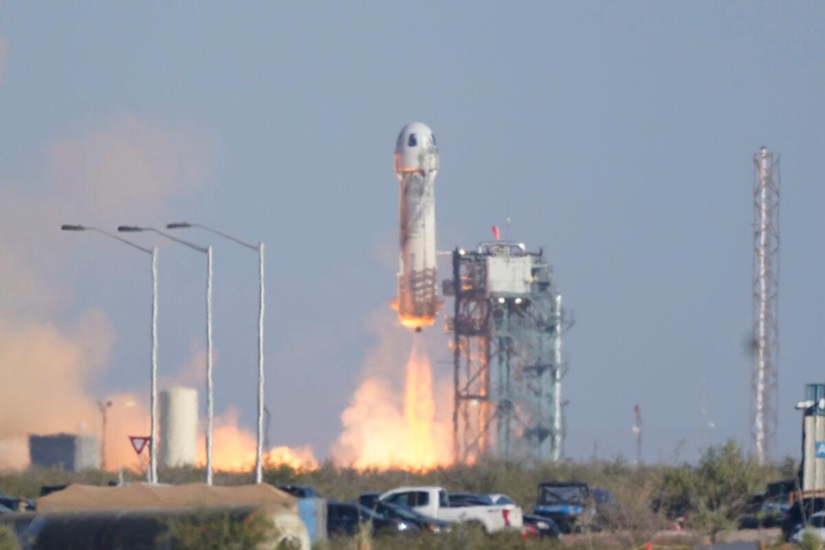 Blue Origin's New Shepard rocket launches carrying passengers William Shatner, Chris Boshuizen, Audrey Powers, and Glen de Vries from its spaceport near Van Horn, Texas, on Oct. 13, 2021. (LM Otero/AP Photo)