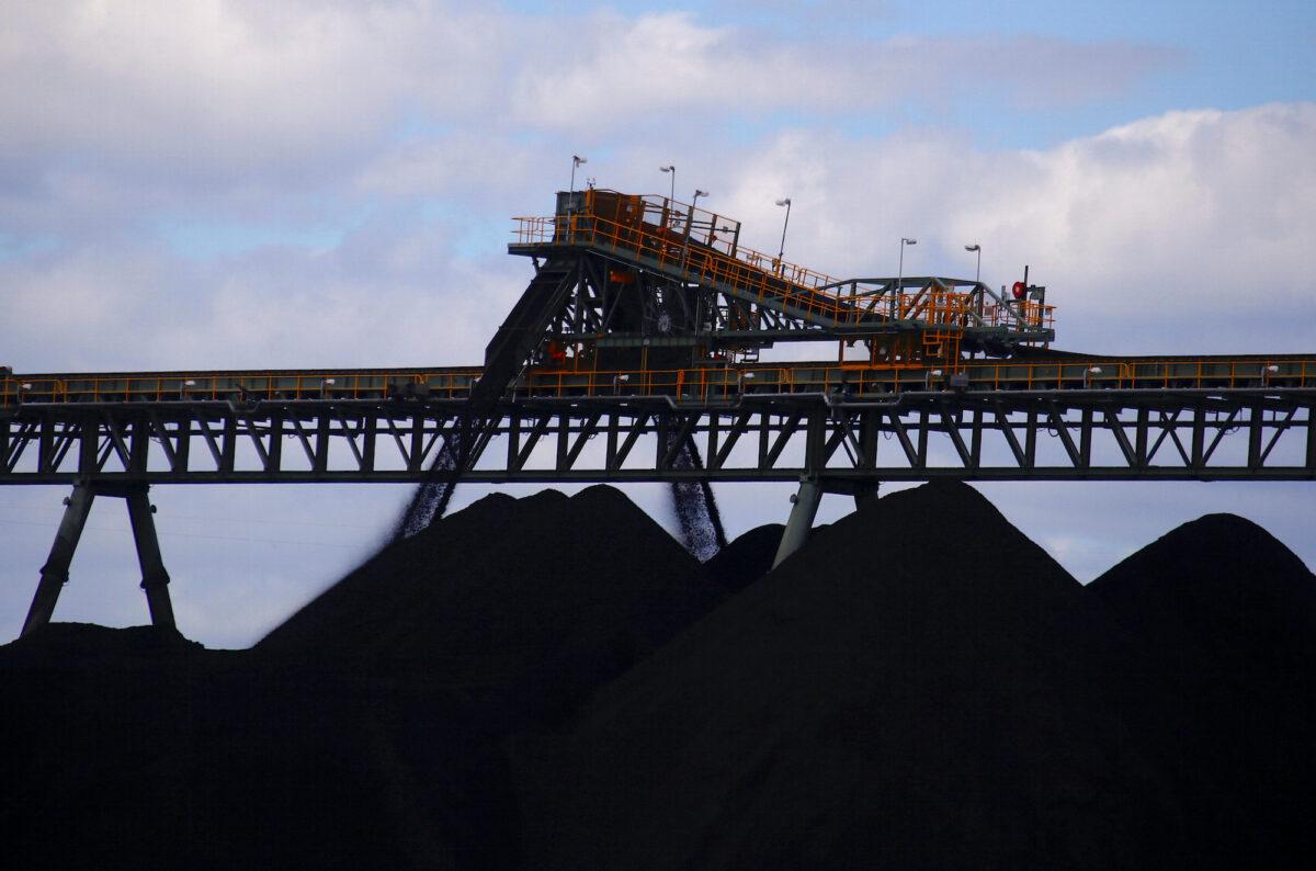 Coal is unloaded onto large piles at the Ulan Coal mines near the central New South Wales rural town of Mudgee, in Australia, on March 8, 2018. (David Gray/Reuters)