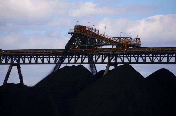 Coal is unloaded onto large piles at the Ulan Coal mines near the central New South Wales rural town of Mudgee in Australia on March 8, 2018. (David Gray/Reuters)