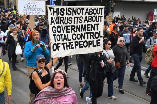 Demonstrators march through the streets to protest lockdowns in Melbourne, Australia, on Sept. 18, 2021. (William West/AFP via Getty Images)