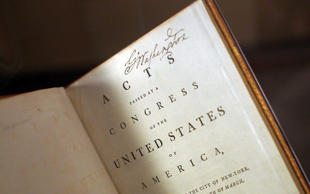 George Washington’s personally annotated copy of the Acts of Congress is displayed on the 225th anniversary of the signing of the U.S. Constitution during an unveiling ceremony in Mount Vernon, Va., on Sept. 17, 2012.  (Win McNamee/Getty Images)