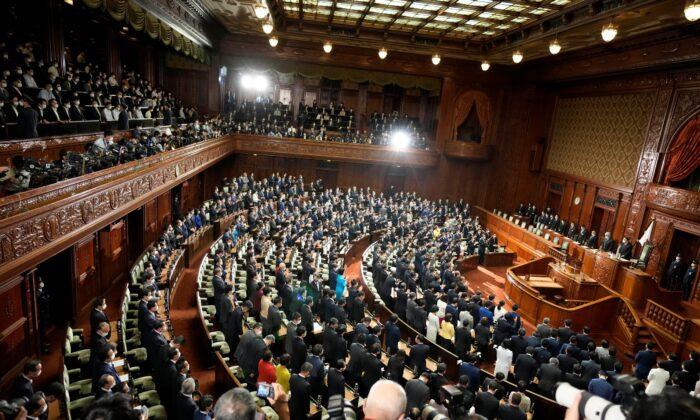 Lawmakers listen to the announcement of the dissolution of the lower house in Tokyo, on Oct. 14, 2021. (Eugene Hoshiko/AP Photo)