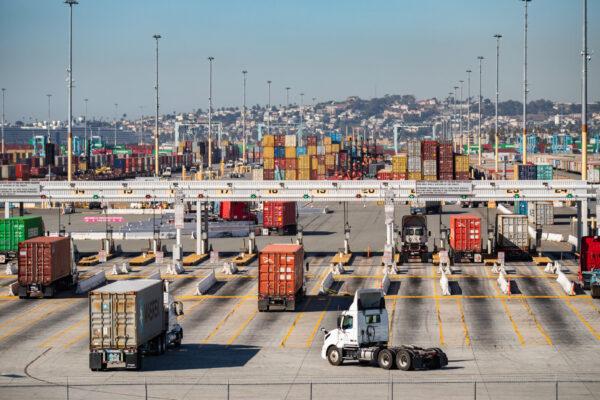 Shipping containers wait to be transferred from the ports of Los Angeles and Long Beach, Calif., on Oct. 14, 2021. (John Fredricks/The Epoch Times)