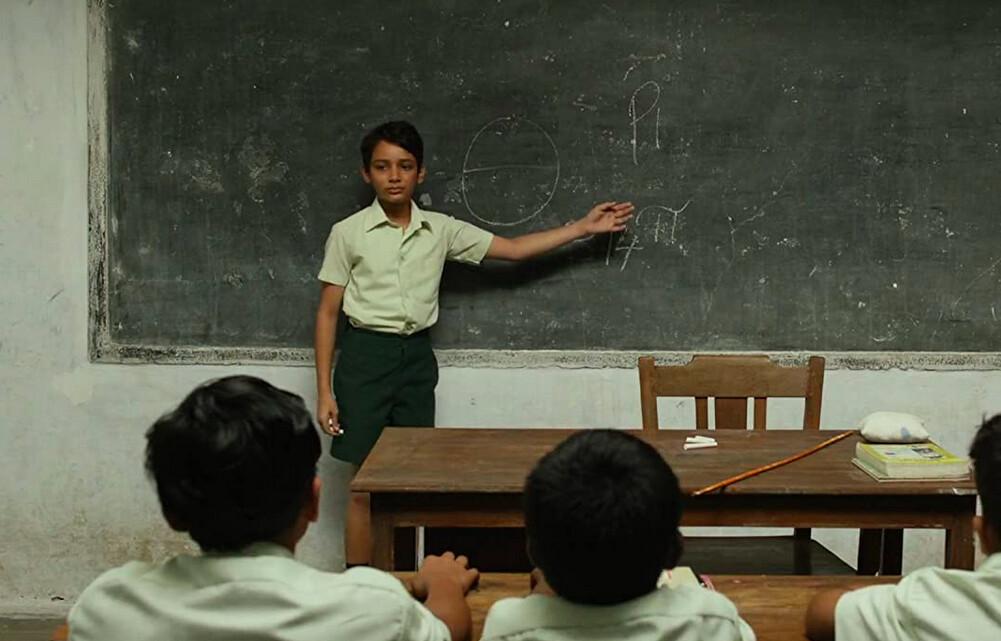 Piscine "Pi" Patel (Ayush Tandon) explains his name to classmates in “Life of Pi.” (Rhythm & Hues/Twentieth Century Fox Film Corporation)