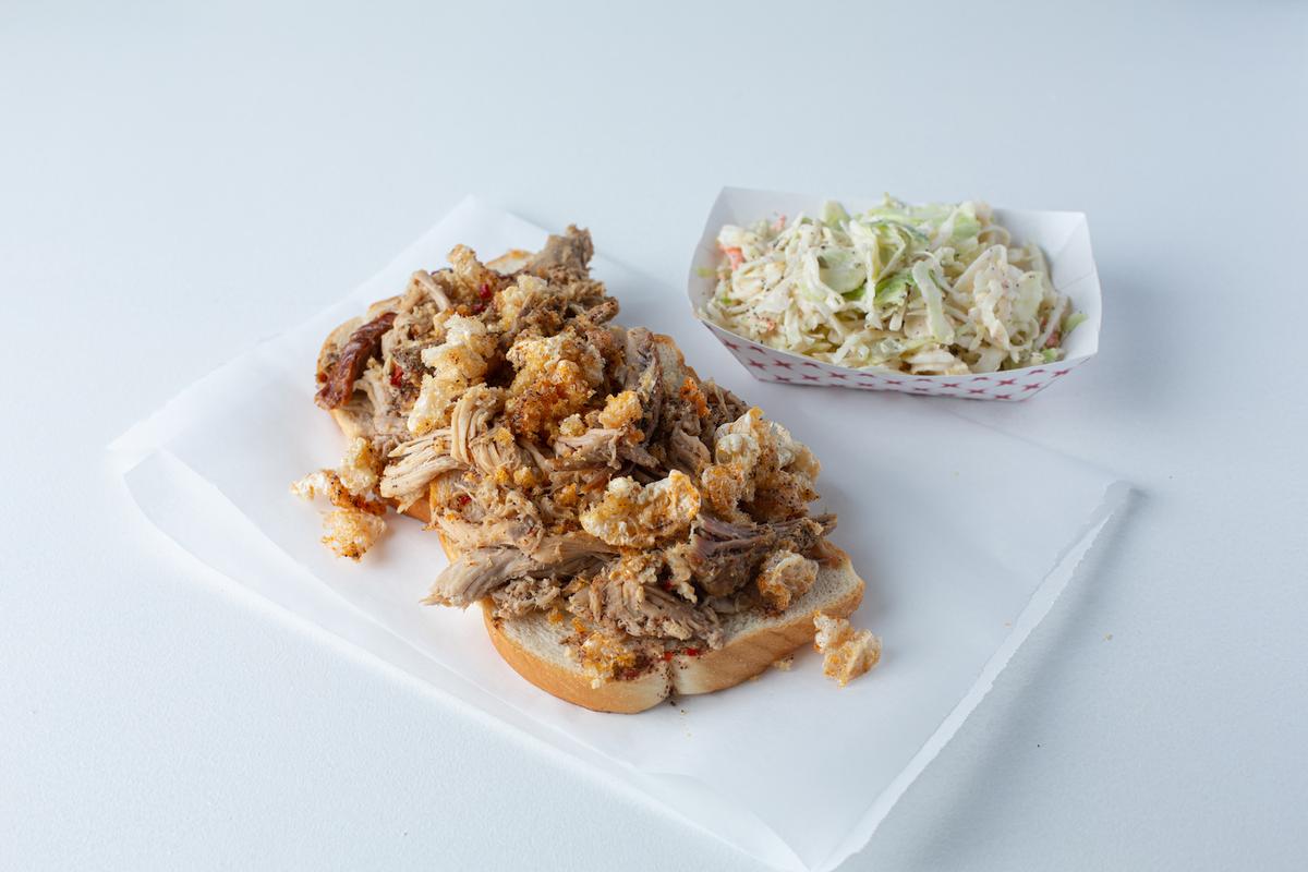 IF YOU GO: Rodney Scott’s advice? “Definitely order the Rod’s Original Whole Hog Pork Sandwich [pictured], ribs, chicken, collards, mac and cheese, and brisket.” Full menu, locations, and contact info at RodneyScottsBBQ.com (Courtesy of Rodney Scott’s BBQ)