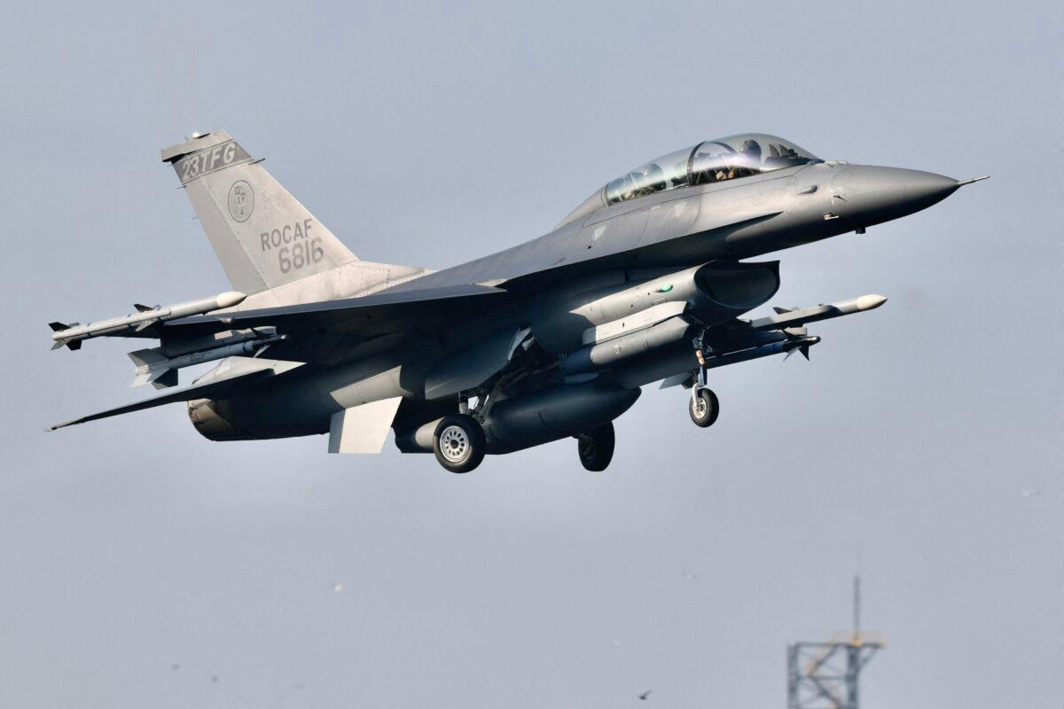 An armed US-made F16 fighter jet takes off from a motorway in Pingtung, southern Taiwan, during the annual Han Kuang drill on Sept. 15, 2021. (Sam Yeh/AFP via Getty Images)