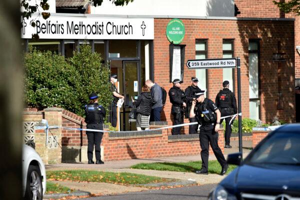 Emergency services at the scene near the Belfairs Methodist Church in Eastwood Road North, where Conservative MP Sir David Amess has reportedly been stabbed several times at a constituency surgery, in Leigh-on-Sea, Essex, England, on Oct. 15, 2021. (Nick Ansell/PA via AP)