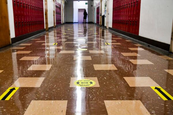 A hallway with social distance decal reminders at Hollywood High School in Los Angeles on April 27, 2021. (Rodin Eckenroth/Getty Images)