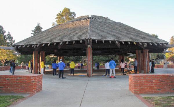 People do the Falun Gong exercises under the pavilion at Ortega Park in Sunnyvale, Calif., on Oct. 3, 2021. (David Lam/The Epoch Times)