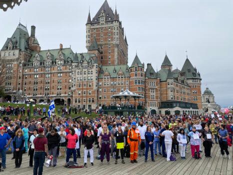 About 1,000 front-line workers and first responders gather in front of Château Frontenac to protest the province's vaccine passport, in Quebec City on Oct. 15, 2021. (Sonia Rouleau/The Epoch Times)