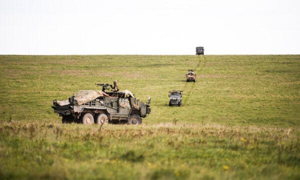 A convoy of armoured vehicles travels between camp locations during the UK Task Group Mission Rehearsal Exercise ahead of their deployment to Mali, on the Ministry of Defence training area on Salisbury Plain in England on Oct. 14, 2020. (Leon Neal/Getty Images)