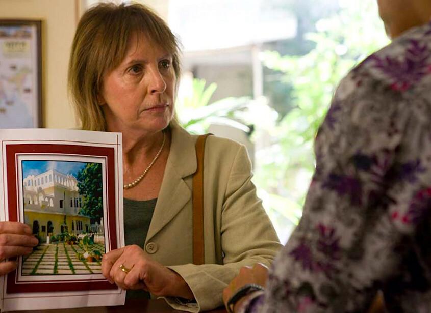 Jean Ainslie (Penelope Wilton) confronts the hotel manager (Dev Patel) with the misleading hotel brochure in "The Best Exotic Marigold Hotel." (Fox Searchlight Pictures)
