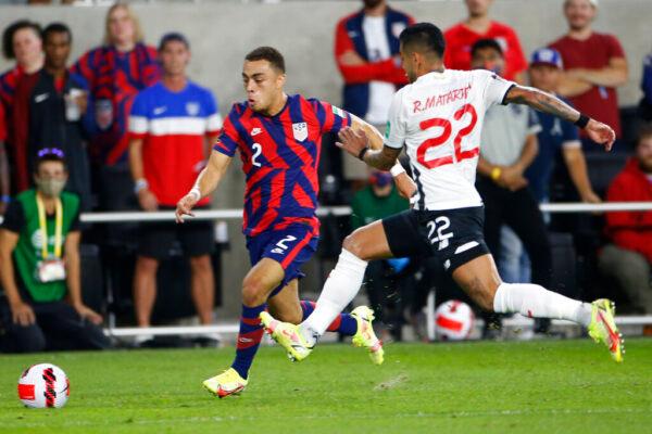 United States' Sergino Dest, left, dribbles the ball upfield as Costa Rica's Ronald Matarrita defends during the first half of a World Cup qualifying soccer match Wednesday, Oct. 13, 2021, in Columbus, Ohio. (AP Photo/Jay LaPrete)