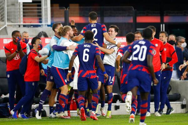 United States' Sergino Dest (2) celebrates his goal against Costa Rica with teammates during the first half of a World Cup qualifying soccer match Wednesday, Oct. 13, 2021, in Columbus, Ohio. (AP Photo/Jay LaPrete)