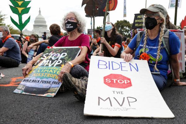 Climate activists at a protest on Capitol Hill, Washington, on Oct. 15, 2021. (Alex Wong/Getty Images)