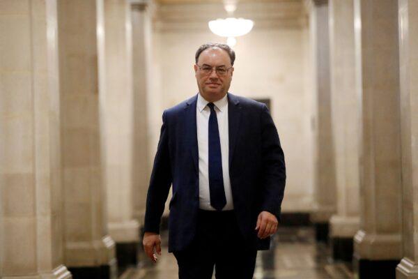 Bank of England Governor Andrew Bailey poses for a photograph on the first day of his new role at the Central Bank in London, Britain on March 16, 2020. (Tolga Akmen/Pool via Reuters)