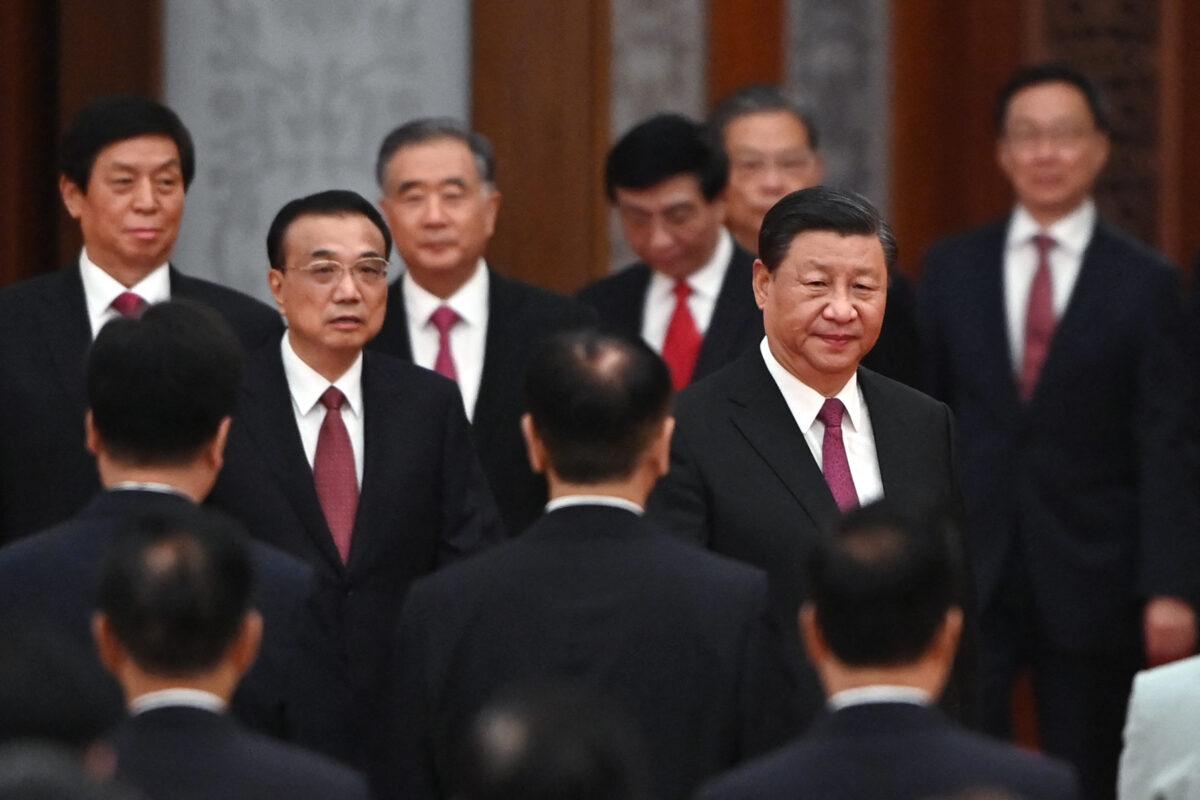 Chinese leader Xi Jinping (right) arrives with Premier Li Keqiang (left) and members of the Politburo Standing Committee for a reception at the Great Hall of the People in Beijing on the eve of China's National Day on Sept. 30, 2021. (Greg Baker/AFP)