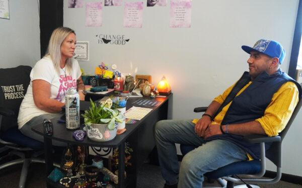 Recovering alcoholic and peer recovery coach Barbara Landry with Steven Sheldon, who is struggling to be free from addiction to crack cocaine, on Oct.14, 2021, in Port Huron, Mich. (Steven Kovac/Epoch Times)