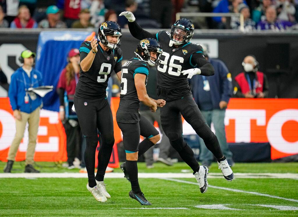 Jacksonville Jaguars kicker Matthew Wright #15 (C) celebrates after kicking a field goal to win the match during the second half of an NFL football game between the Miami Dolphins and the Jacksonville Jaguars at the Tottenham Hotspur stadium in London, England, on Sunday, Oct. 17, 2021. (AP Photo/Matt Dunham)