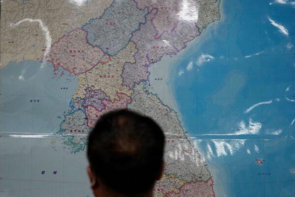 A Chinese-North Korean refugee who wished to be identified only as Yoon speaks in front of a map of the Korean peninsula during an interview in Seoul, South Korea, September 13, 2021. (Lee Jin-man/AP Photo)