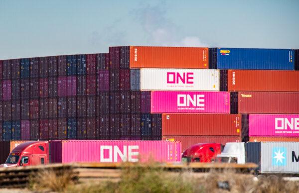 Shipping containers wait to be transferred from the ports of Los Angeles and Long Beach on Oct. 14, 2021. (John Fredricks/The Epoch Times)