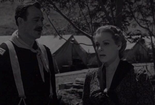Lt. Col. Kirby Yorke (John Wayne, L) attempts to explain the military way of life to Kathleen Yorke (Maureen O’Hara), in “Rio Grande.” (Republic Pictures)