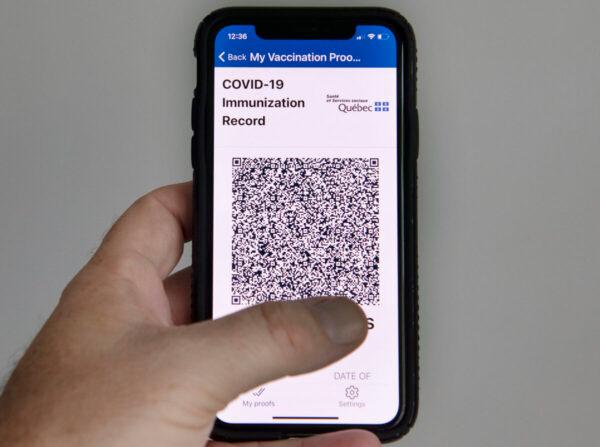  The Quebec government’s new vaccine passport, called VaxiCode, is shown on a phone in Montreal on Aug. 25, 2021. (Graham Hughes/The Canadian Press)