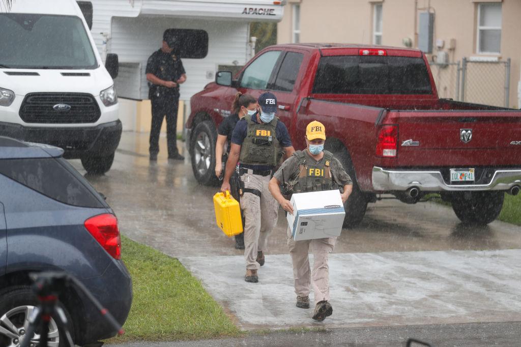 FBI agents begin to take away evidence from the family home of Brian Laundrie, who is a person of interest after his fiancé Gabby Petito went missing in North Port, Fla., on Sept. 20, 2021. (Octavio Jones/Getty Images)