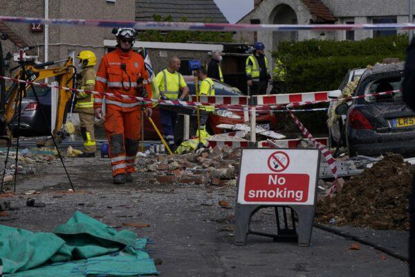 Emergency workers at the scene of a suspected gas explosion, in which a young child was killed and two people were seriously injured, on Mallowdale Avenue, Heysham, UK, on May 16, 2021. (Danny Lawson/PA)