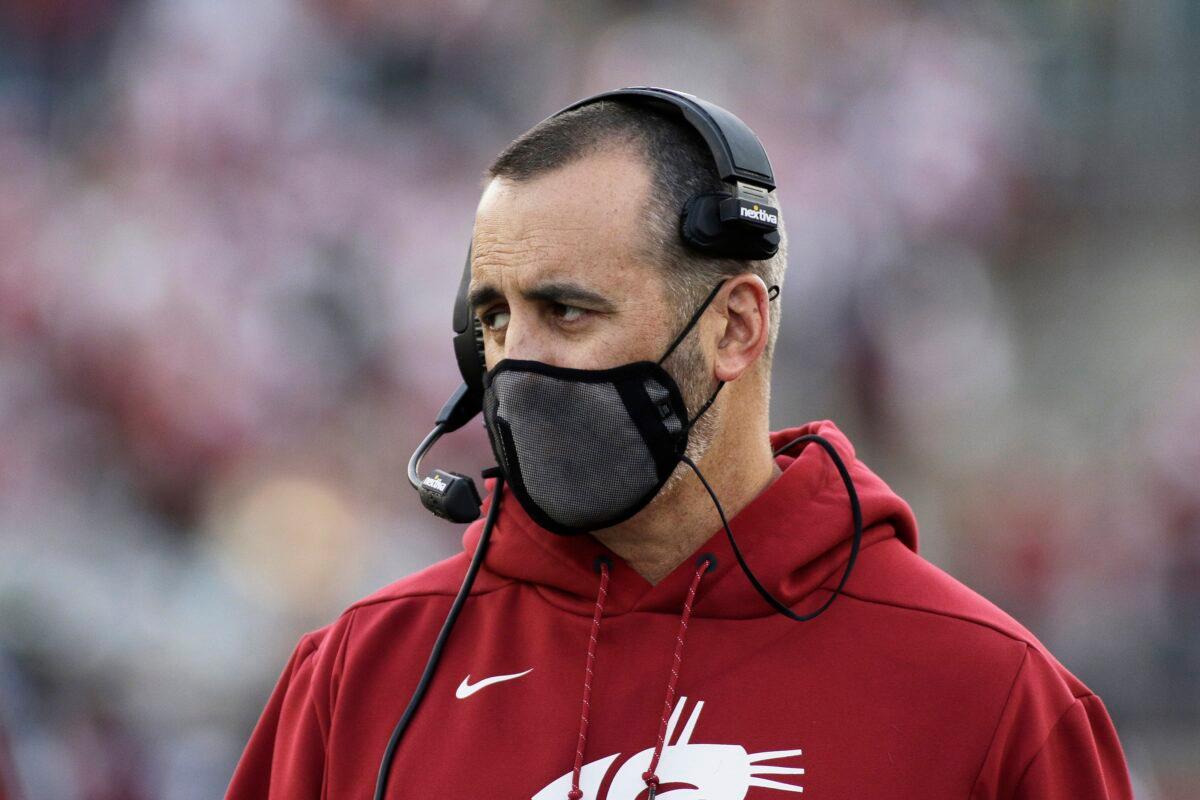Washington State coach Nick Rolovich, seen during the team's NCAA college football game against Stanford in Pullman, Wash., on Oct. 16, 2021, was one of the state employees fired for refusing to get a COVID-19 vaccine after his religious exemption application was denied. (Young Kwak/AP Photo)