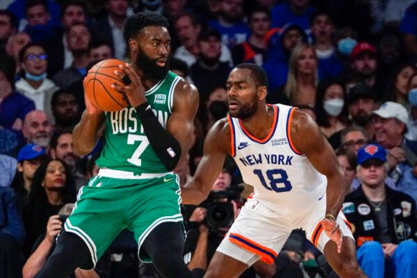 New York Knicks' Alec Burks (18) defends Boston Celtics' Jaylen Brown (7) during the first half of an NBA basketball game in New York on Oct. 20, 2021. (Frank Franklin II/AP Photo)