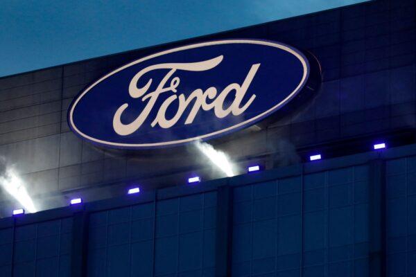 Ford Motor Company's logo is seen on the side of the building at the unveiling of their new electric F-150 Lightning outside of their headquarters in Dearborn, Mich., on May 19, 2021. (Jeff Kowalsky/AFP via Getty Images)