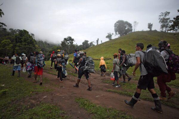 Haitian migrants cross the jungle of the Darien Gap, near Acandi, Colombia, heading to Panama, on their way to the United States, on Sept. 26, 2021. (Raul Arboleda/Getty Images)